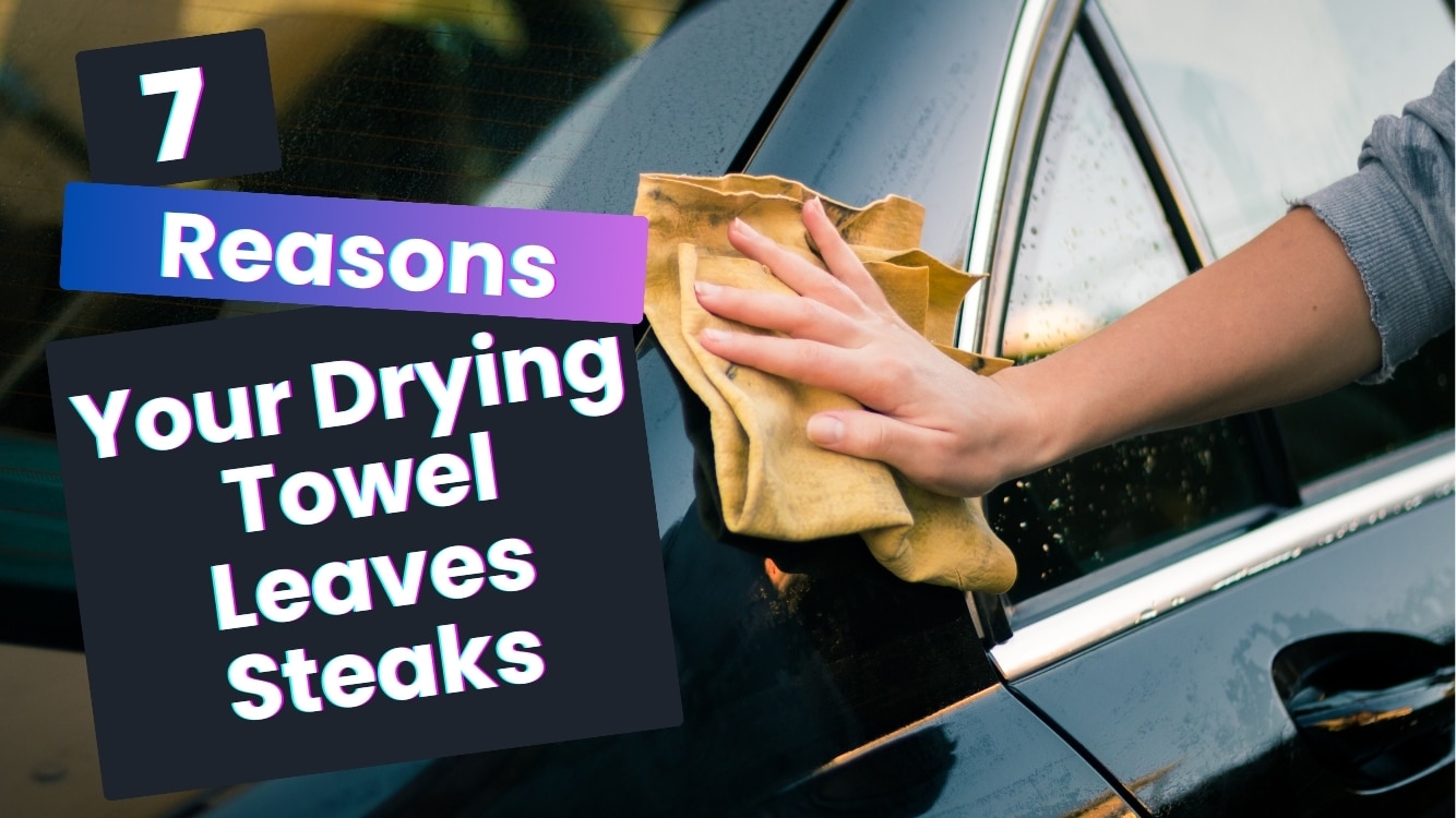 Hand wiping a black car door with a drying towel, image with text overlay explaining 7 reasons car drying towels leave streaks